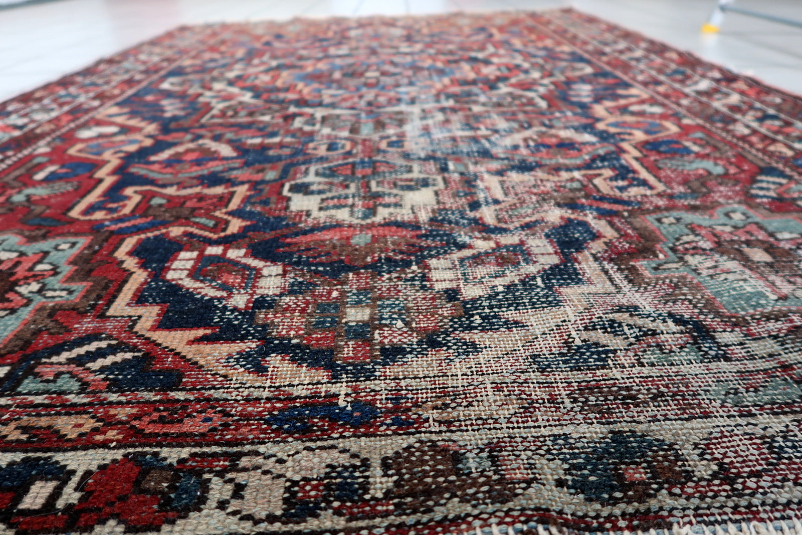 Distressed antique Persian Hamadan rug 1920s wool 4.3 ft x 6.5 ft village weaving tradition medallion design.

