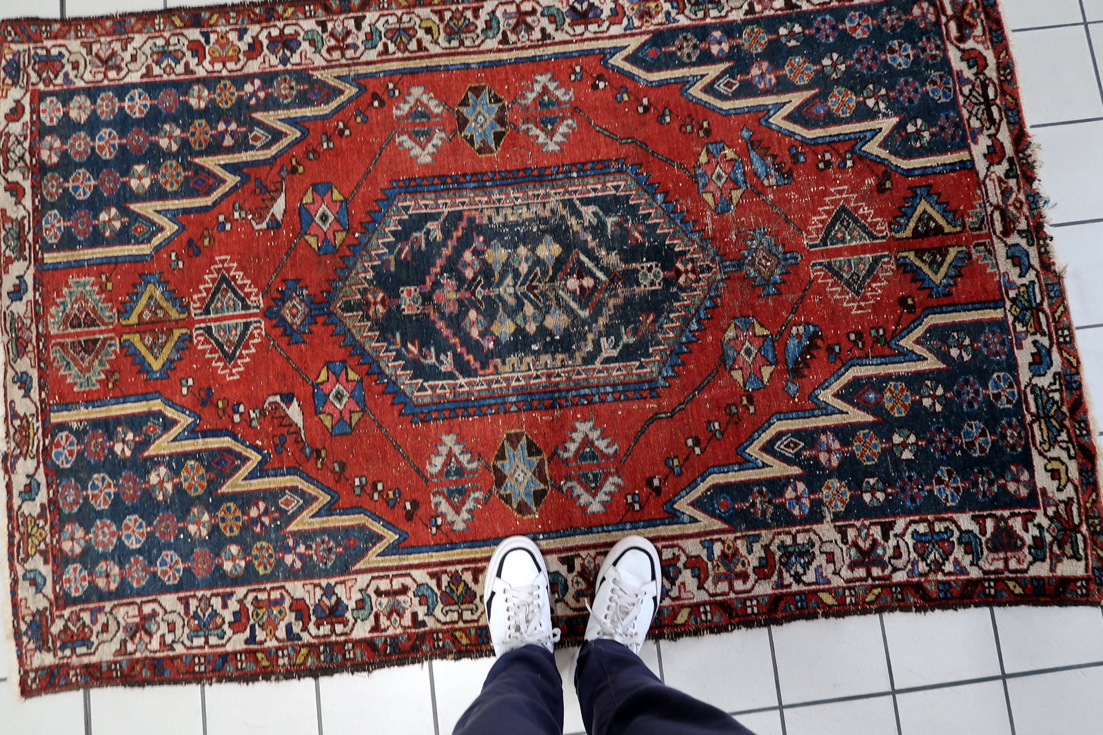 Vintage 4.2x6.4 ft red and navy tribal rug from Persia.

