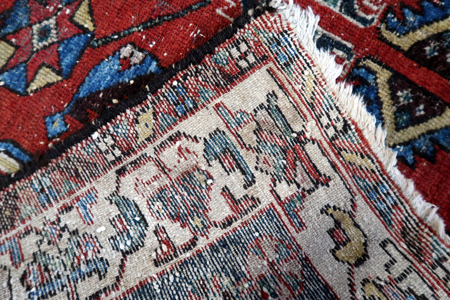 Hand-knotted 1920s Hamadan carpet with geometric medallion.

