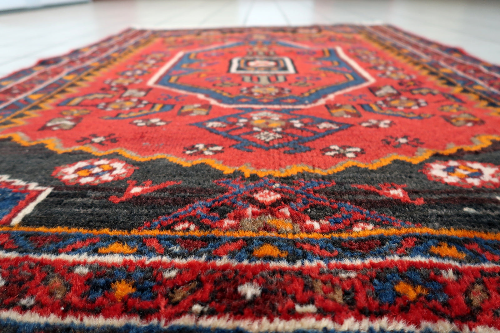 Hand-knotted 1930s Hamadan carpet, vibrant red with geometric medallion.

