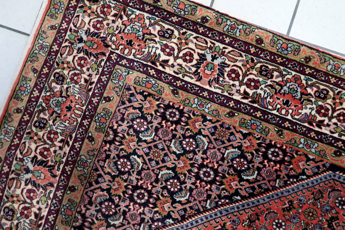 Hand-knotted 1950s Bidjar carpet, deep red with floral-geometric design.

