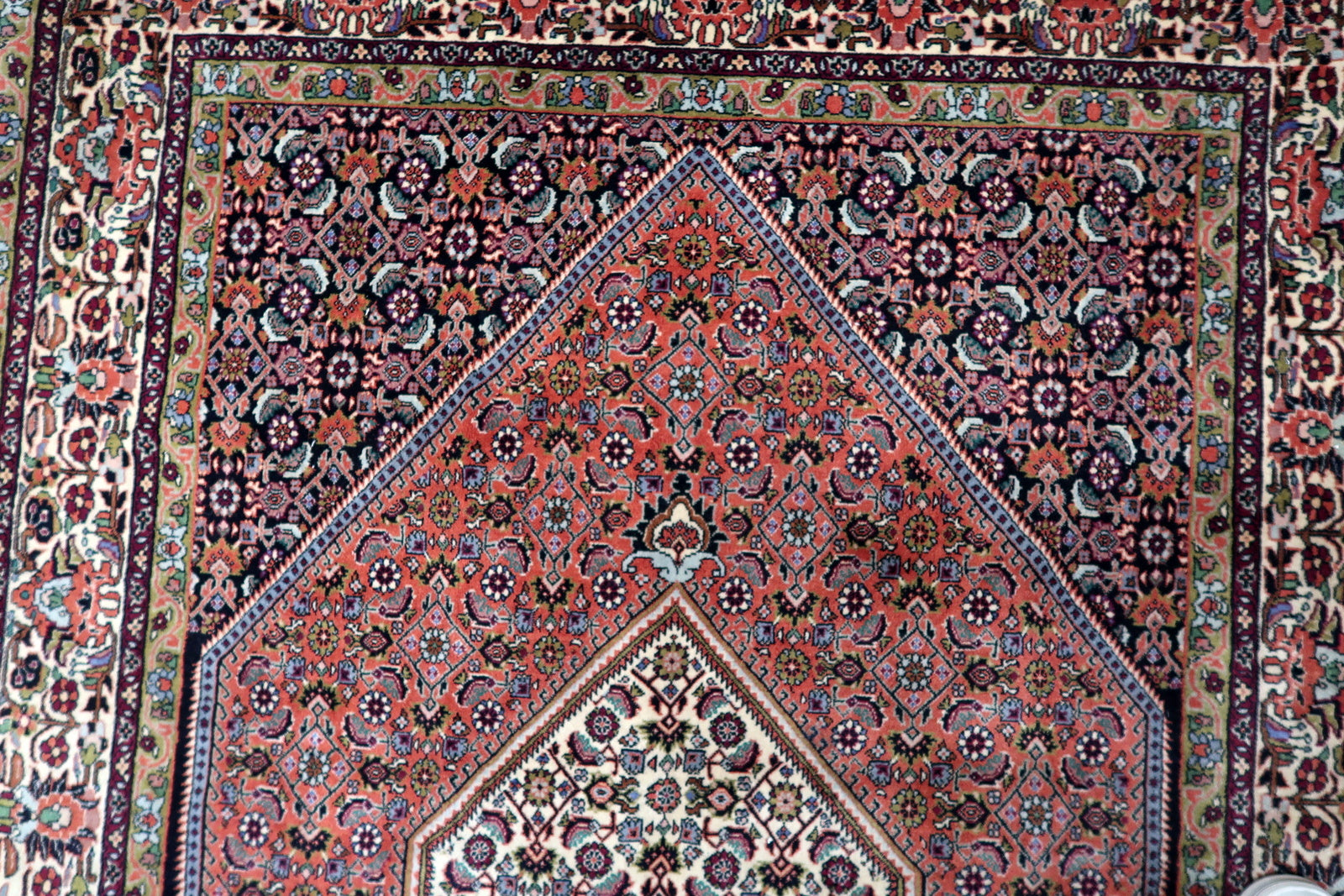 Durable vintage area rug with a central medallion and intricate detailing, ideal for adding warmth and character to a living room, office, or high-traffic interior space.

