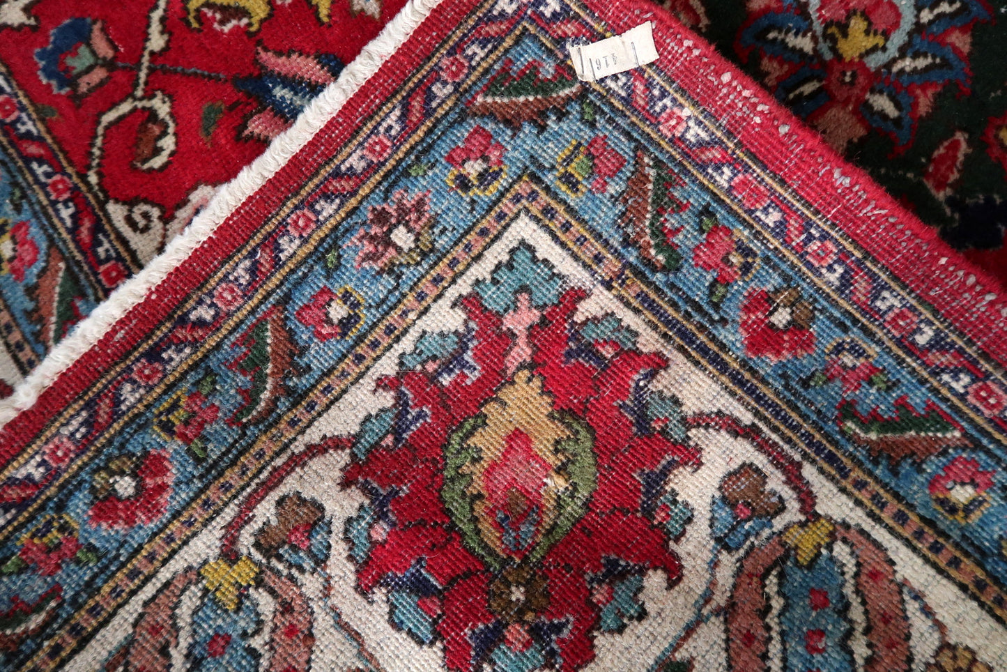 Antique Persian Tabriz carpet circa 1920s in good antique condition, with short and worn ivory wool fringe at ends, dark brown/black elements showing natural oxidation (iron-based dye chemical process, normal for antique rugs), and honest signs of age.

