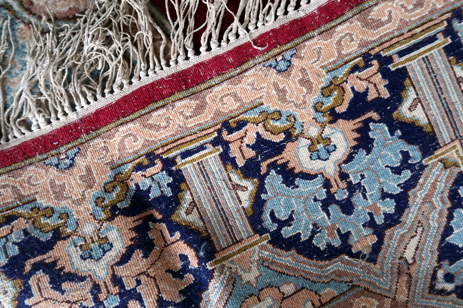 Antique Persian Kerman carpet circa 1930s in good antique condition – field and medallion very good with full, dense, lustrous pile; border good with some pile variation consistent with age; colors vivid throughout; ivory wool fringe present but uneven.

