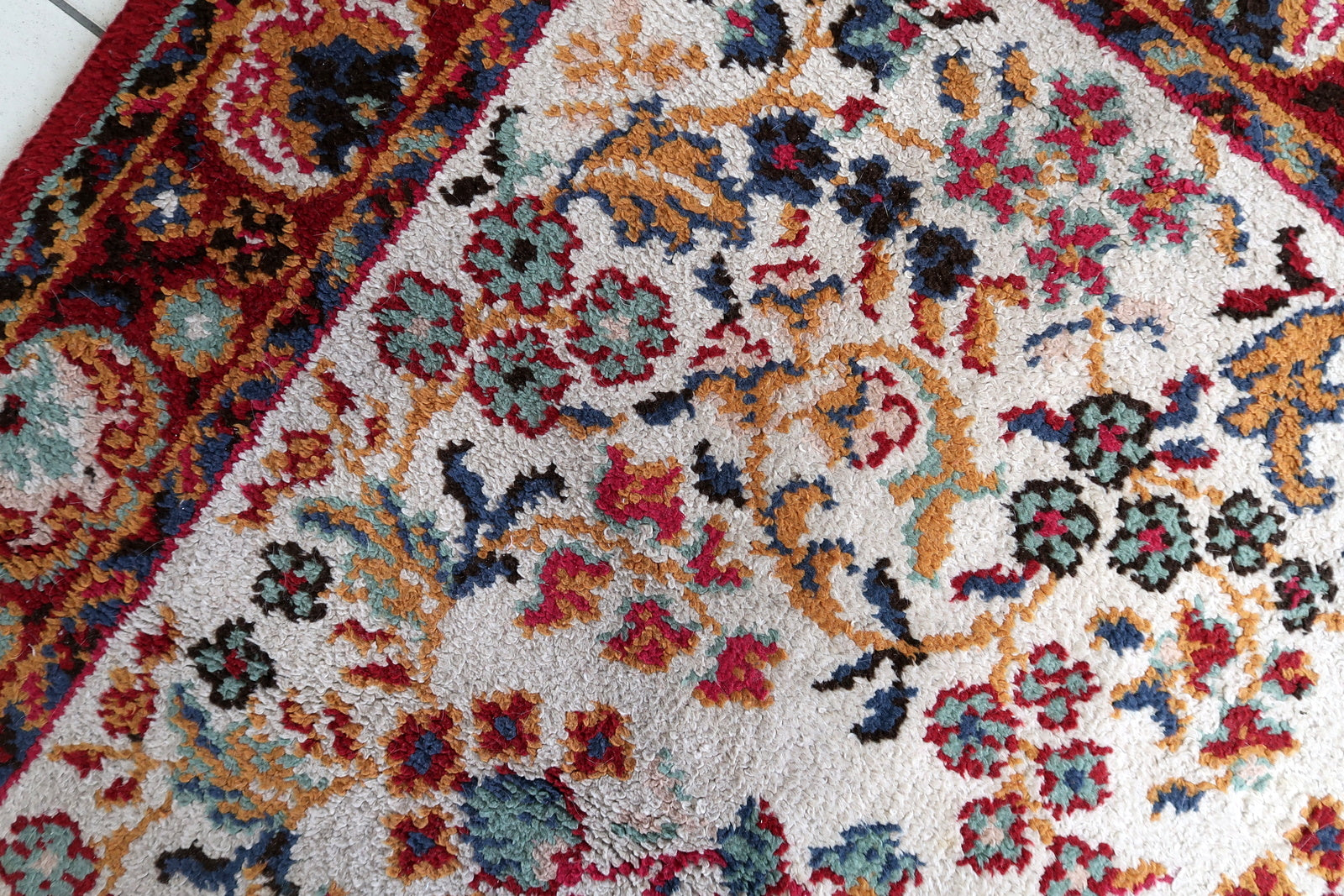 Vintage French hand-knotted Savonnerie rug in room-size format (202 × 290 cm), produced in a postwar French atelier, with an open ivory field, central rosace medallion, and scattered floral garden composition in the Louis XV tradition.

