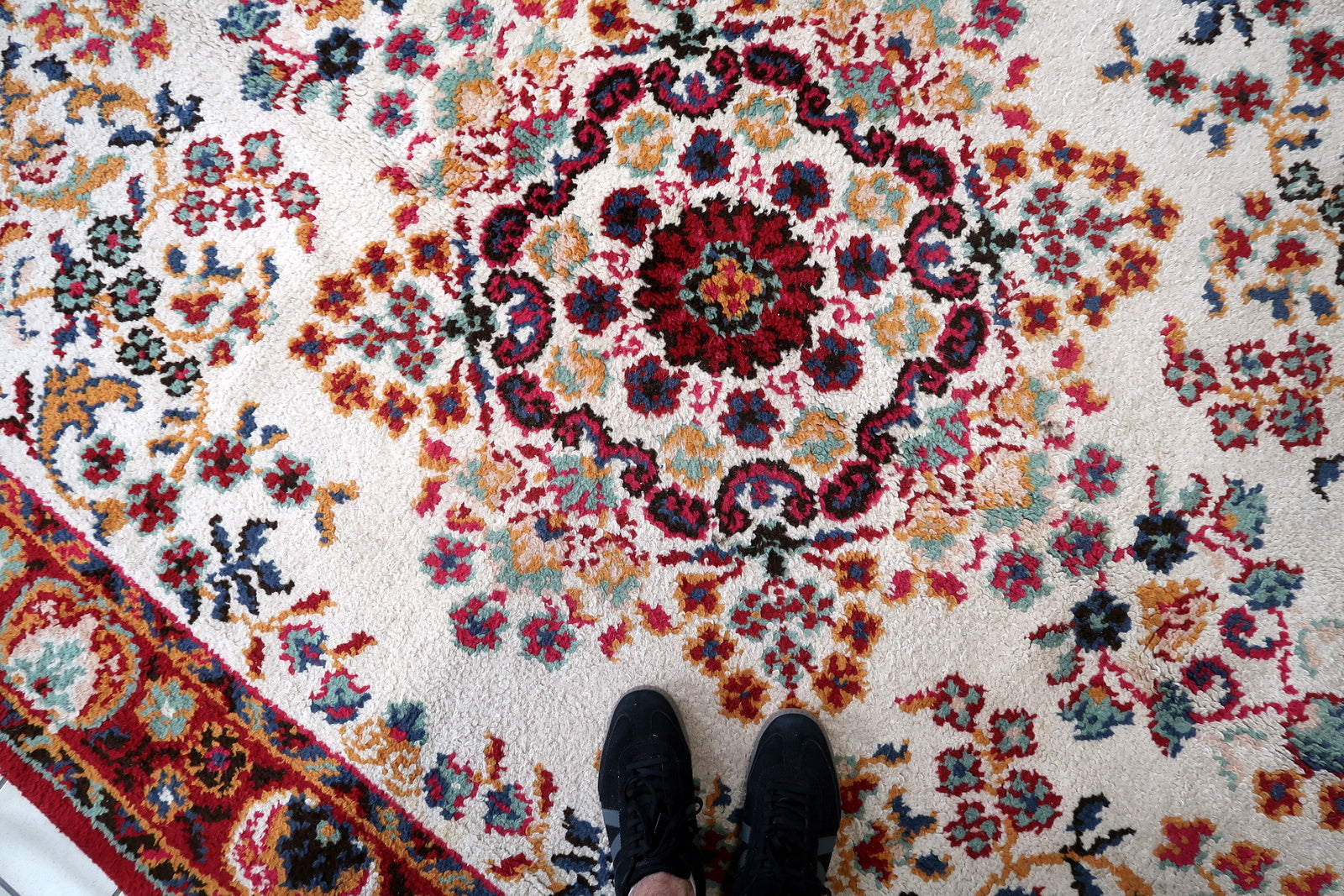 Vintage French workshop rug with medium-high, dense, exceptionally lustrous cut wool pile, showing the characteristic velvet-like sheen across the ivory field – full and even throughout after approximately 70 years.

