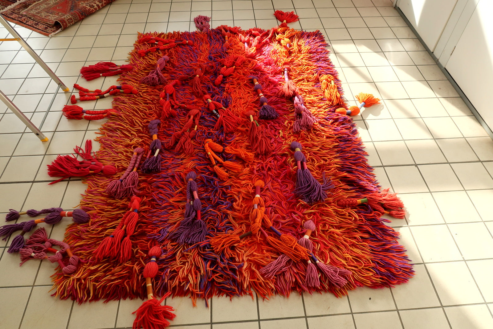 High‑pile Swedish Rya carpet with expressive abstract sunset palette

