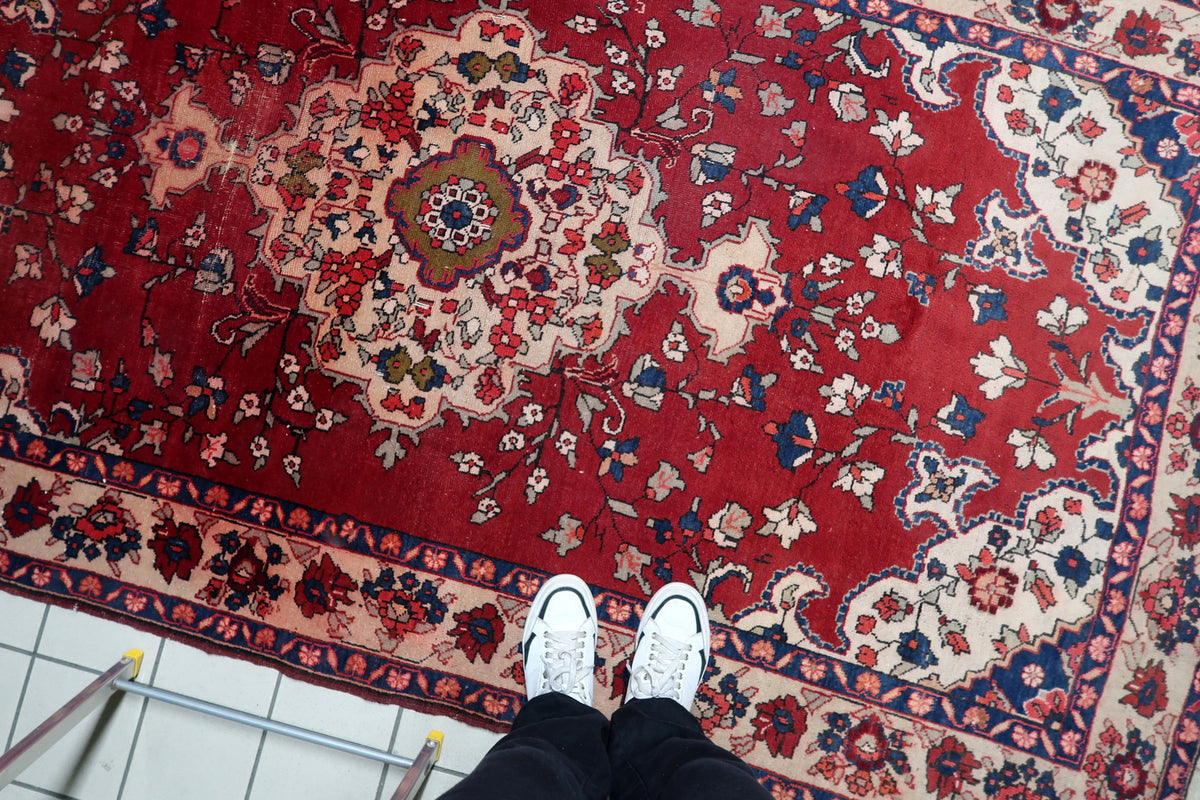 Soft madder root red, deep indigo blue, and warm cream vegetable dyes on an antique floral Malayer rug.