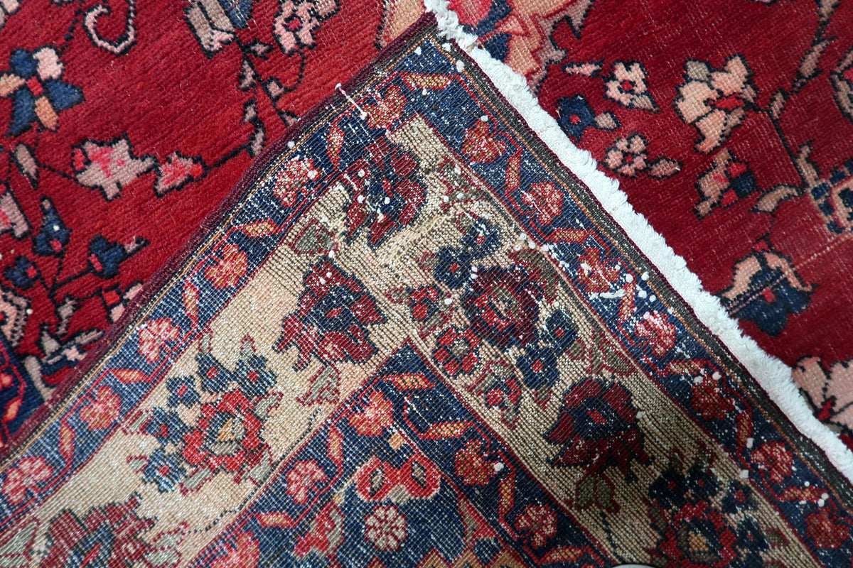 Natural directional wool sheen reflecting light across the hand-spun wool surface of a Persian accent rug.