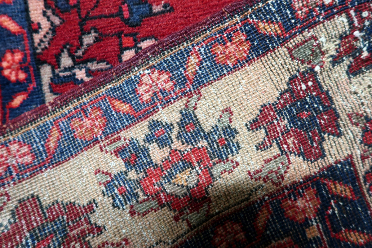 Proportional dimensions and authentic weave construction of a hand-knotted antique 1920s Malayer area rug.