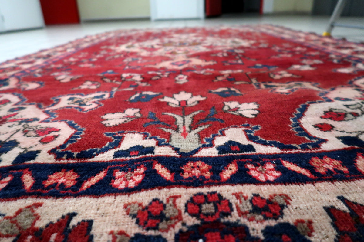Gentle vintage distressing and authentic historic character consistent with a 1920s Persian hand-knotted textile.