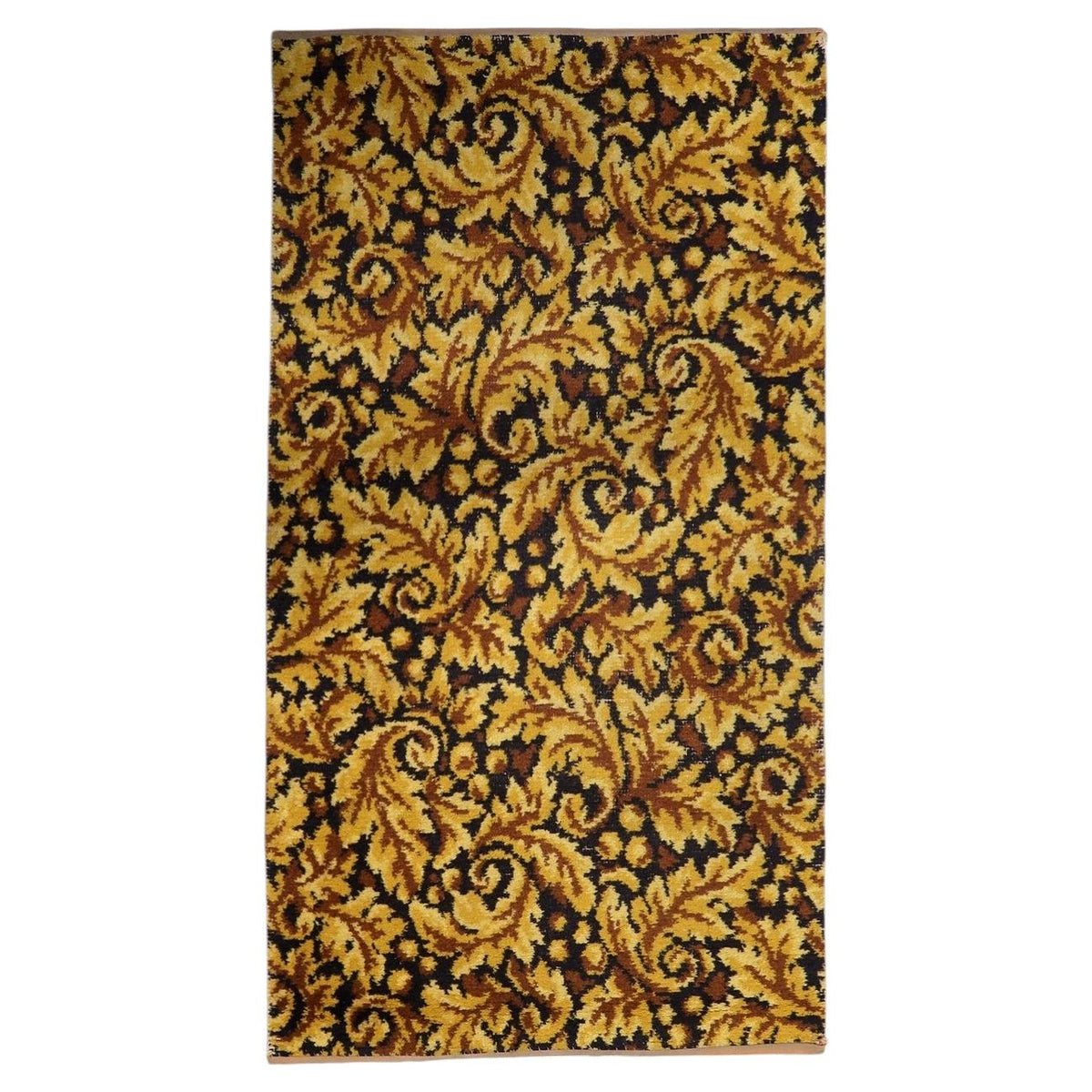Vintage 1960s German acrylic area rug featuring rich gold and deep brown foliate scrollwork across a dense woven pile (Ref: 1C1287).