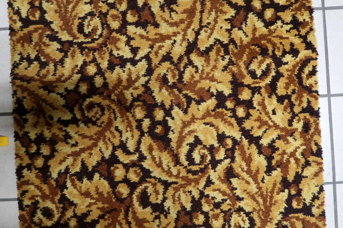Long vintage runner rug from Germany, showcasing a gold field with intricate brown botanical ornamentation