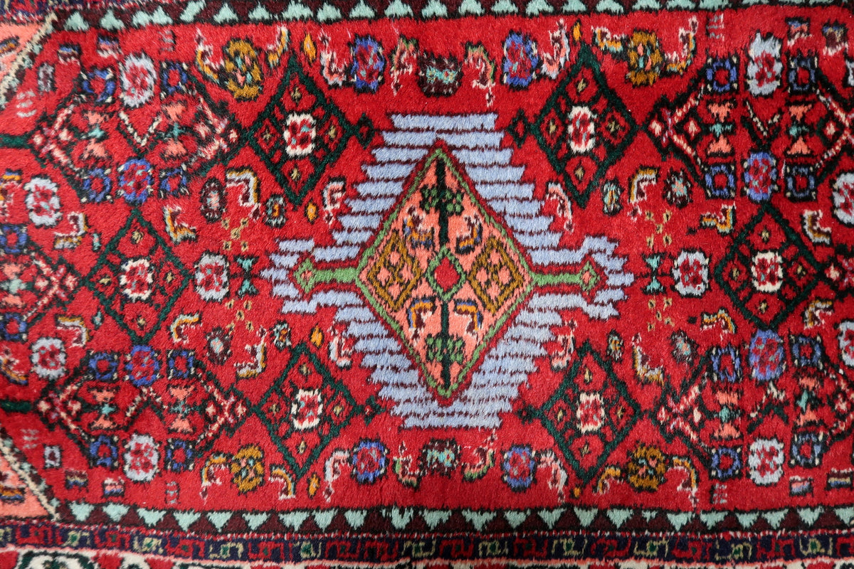1960s handcrafted wool carpet showcasing a detailed medallion pattern and timeless craftsmanship