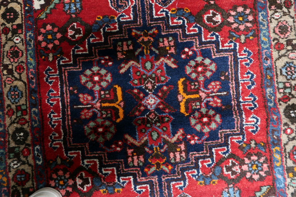 Large handmade area rug with detailed medallion composition and elegant border patterns
