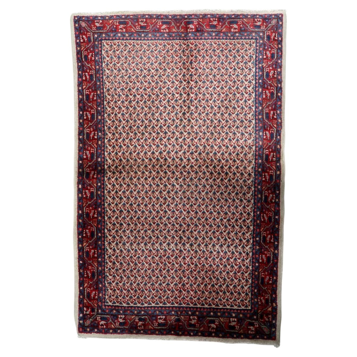 Vintage 1950s handmade Indian wool area rug in warm ivory and red color scheme (Ref: 1C1291).