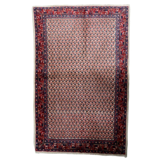 Vintage 1950s handmade Indian wool area rug in warm ivory and red color scheme (Ref: 1C1291).