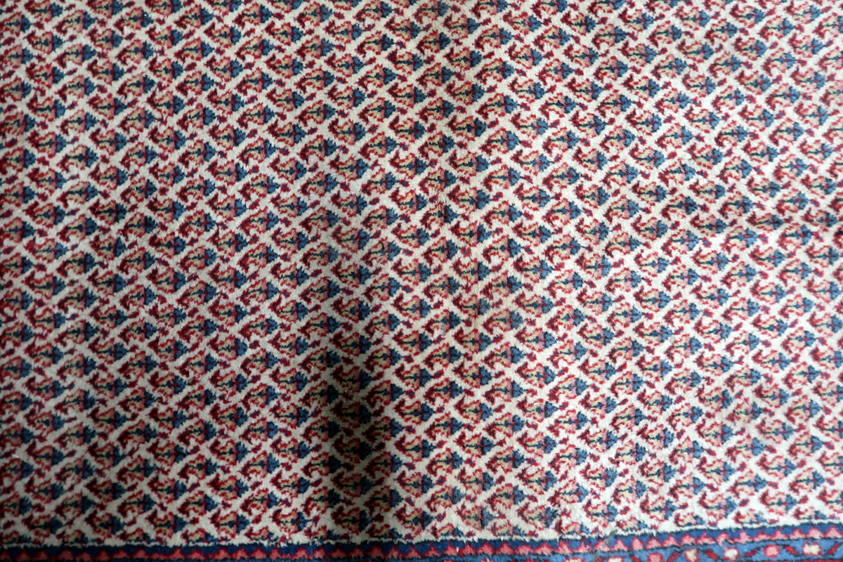 Soft dense natural wool pile on an authentic mid-20th century Indian decorative floor carpet.