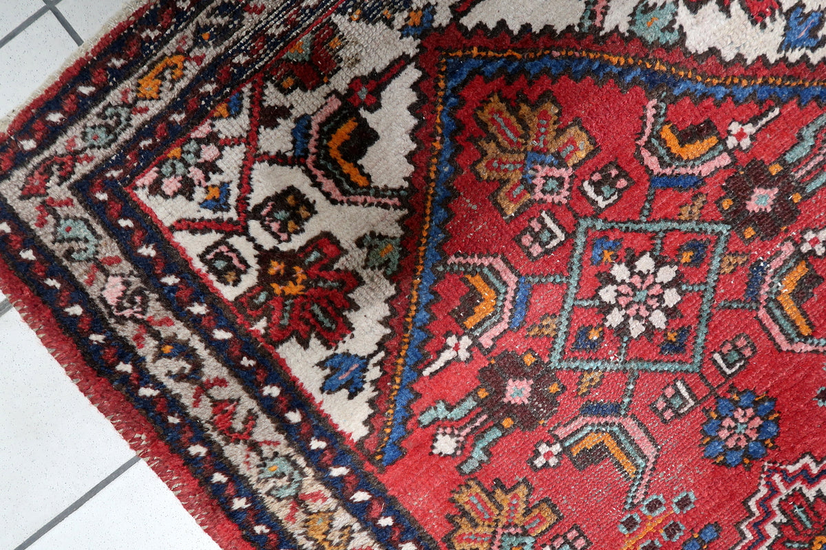 Low-profile hand-spun wool pile woven with authentic vegetable dyes and natural abrash color shifts.
