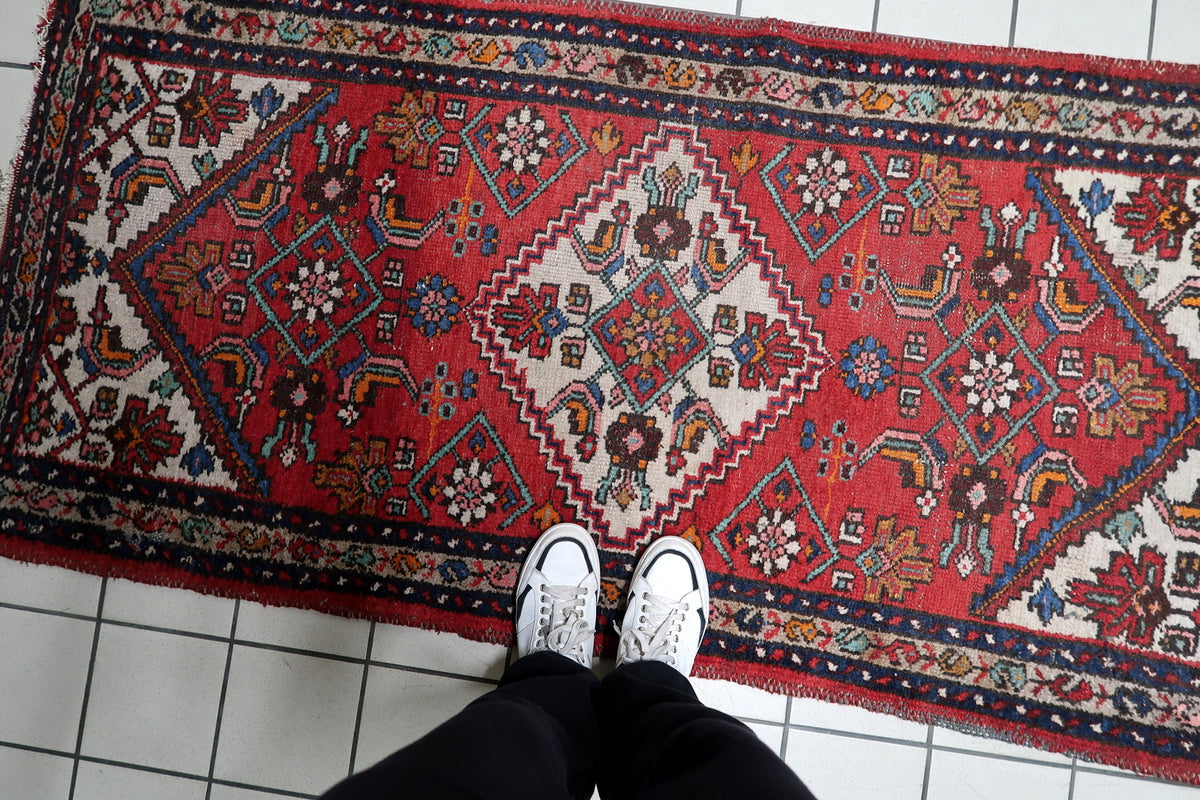 Authentic 100-year-old vintage patina, gentle age wear, and character on a 1920s antique wool floor carpet.