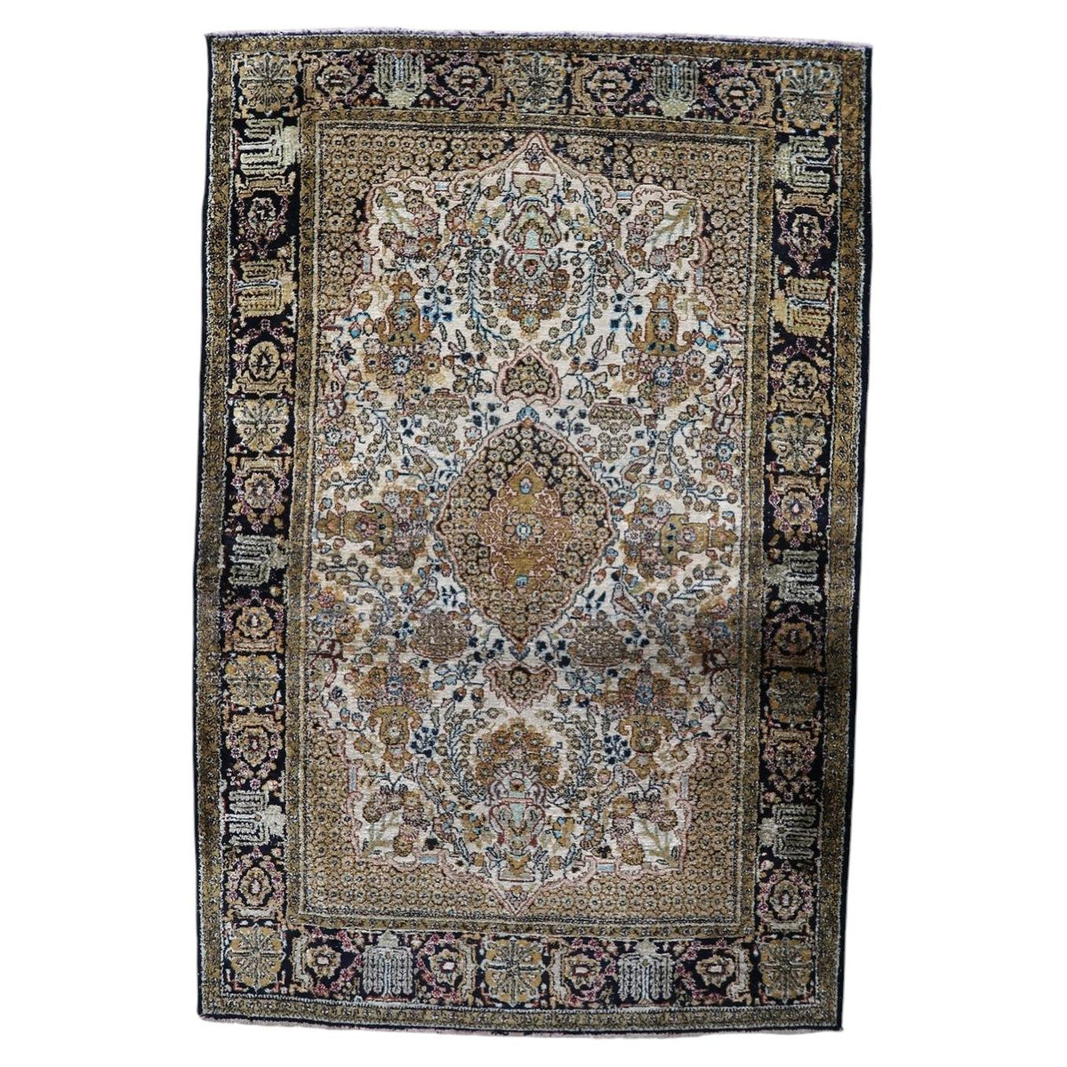 Vintage 1950s handmade Kashmir silk area rug with central medallion and intricate floral motifs in rich jewel tones (Ref: 1C1293).
