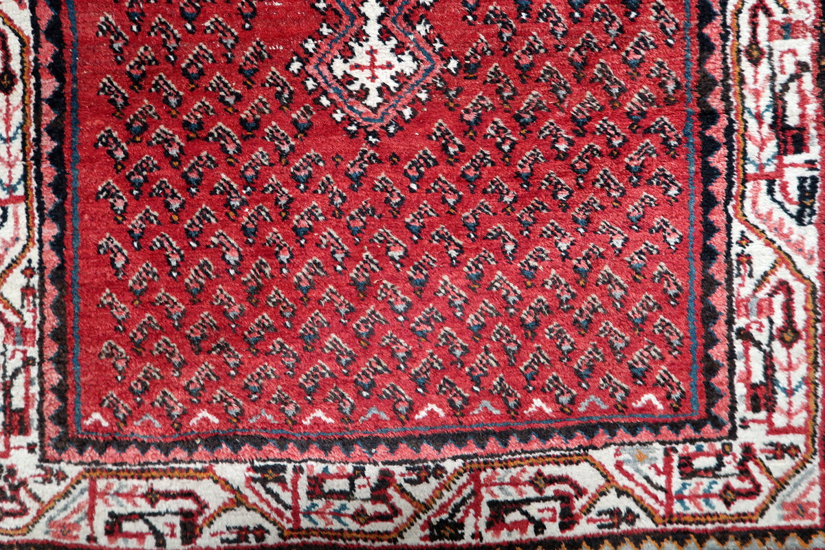 Durable hand-tied cotton warp foundation and tight knot construction on a 1950s vintage medallion scatter rug.
