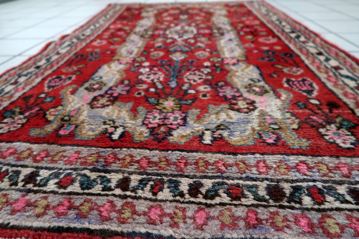 Symmetrical floral medallion design framed by traditional oriental botanical elements and decorative scrollwork.