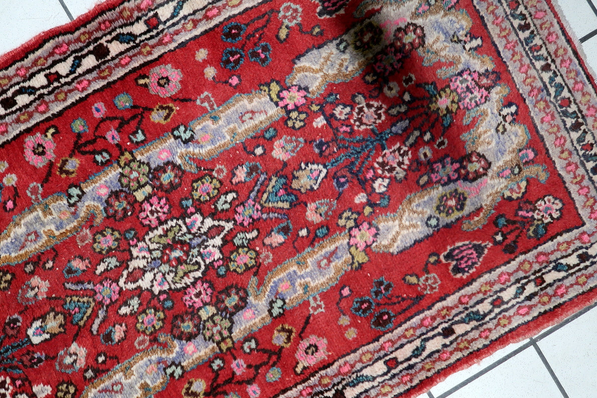 Durable hand-tied cotton warp foundation and tight knot construction on a 1950s vintage medallion scatter rug.