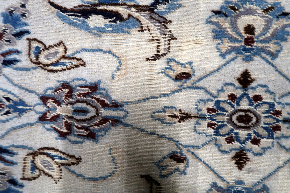 Durable hand-tied cotton foundation and tight knot construction on a 1950s vintage oriental accent carpet.