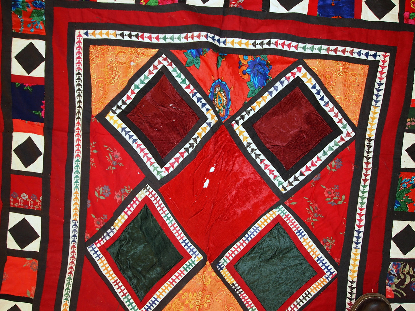 Smaller squarish patches along border detail

