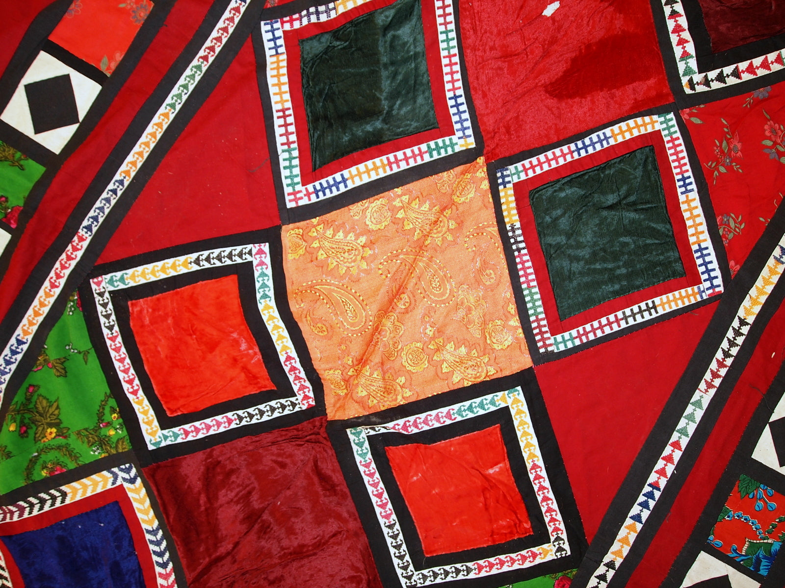 Hand-stitching details on patchwork elements

