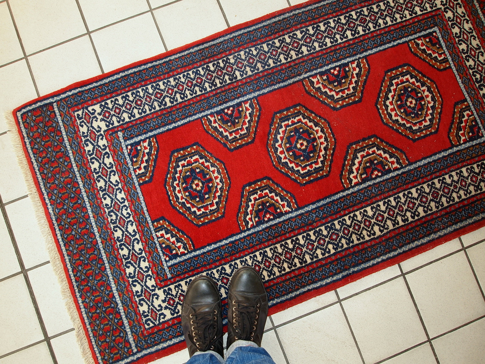 Wool handmade Indo-Mahal rug with a rich red background and blue accents.

