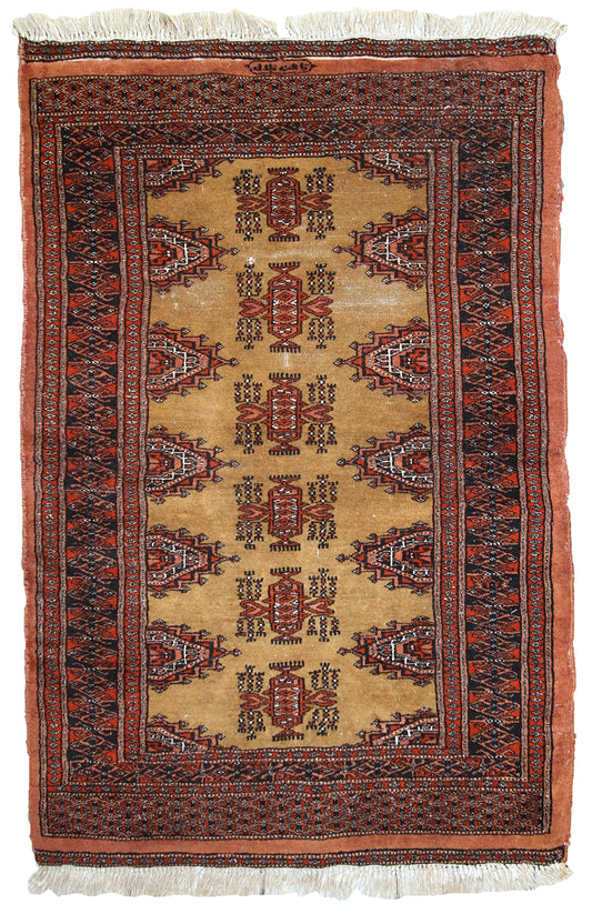 Handmade vintage Uzbek Bukhara rug with vibrant yellow, red, orange, and navy colors.

