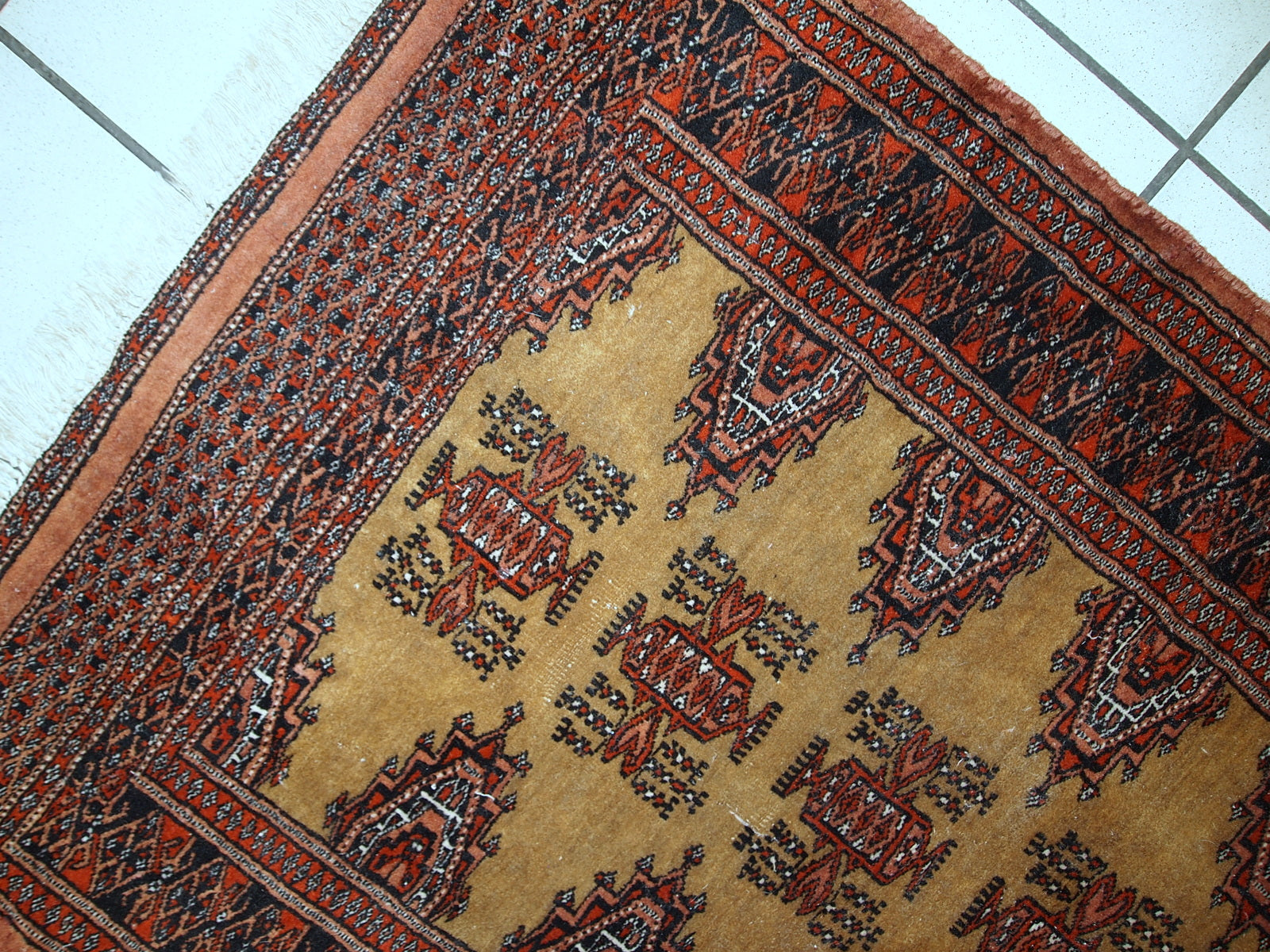 Close-up view of the intricate wool weaving in the 1960s vintage Bukhara rug.

