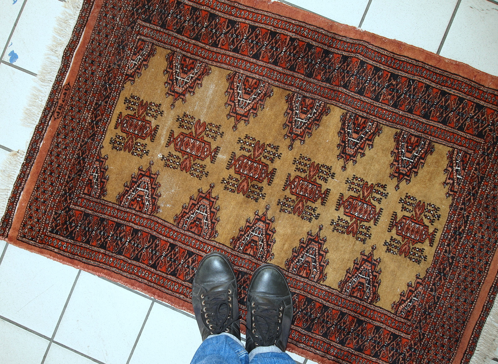 Full view of the handmade vintage Bukhara rug with a soft wool texture.

