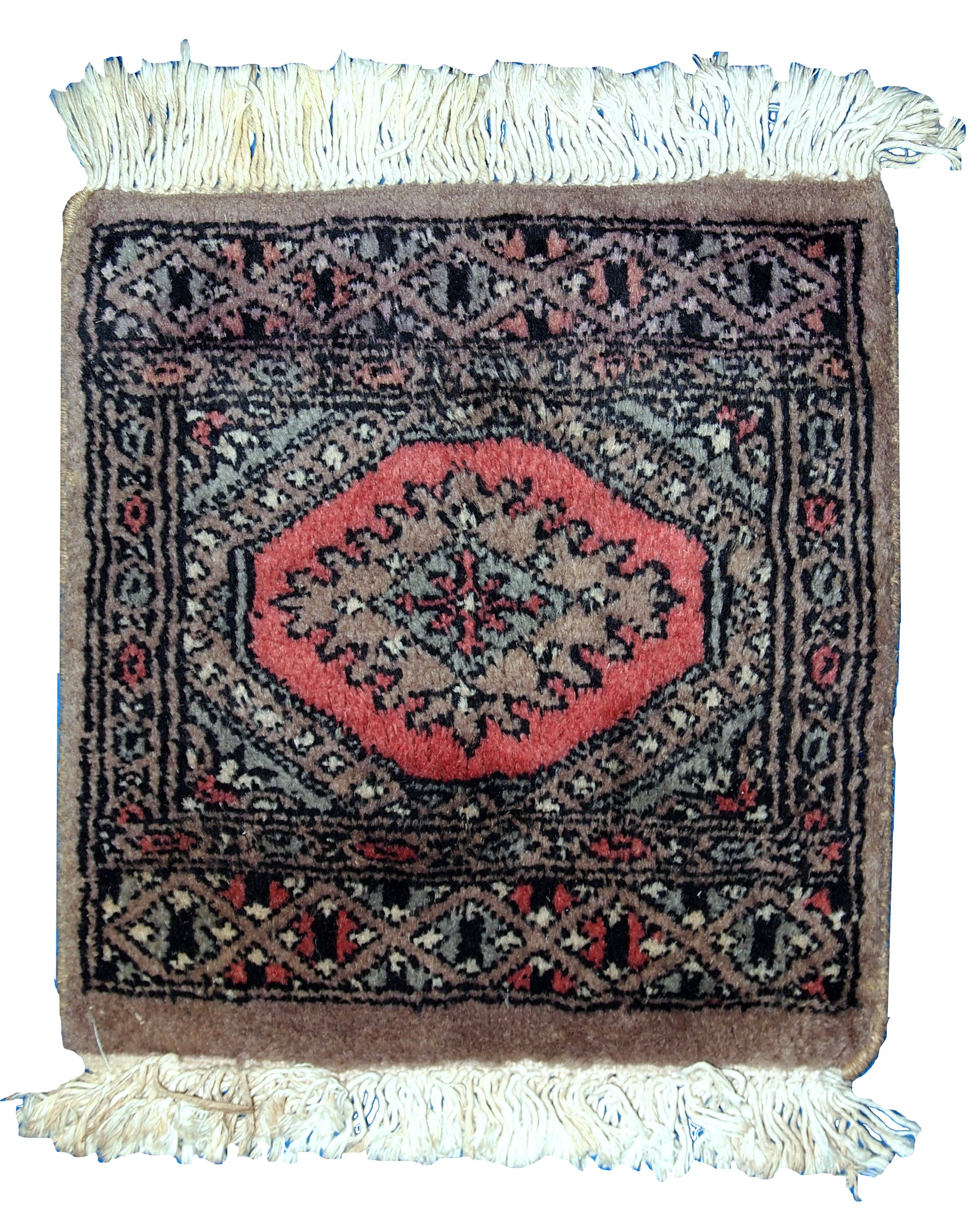Close-up of red and black wool Bukhara mat

