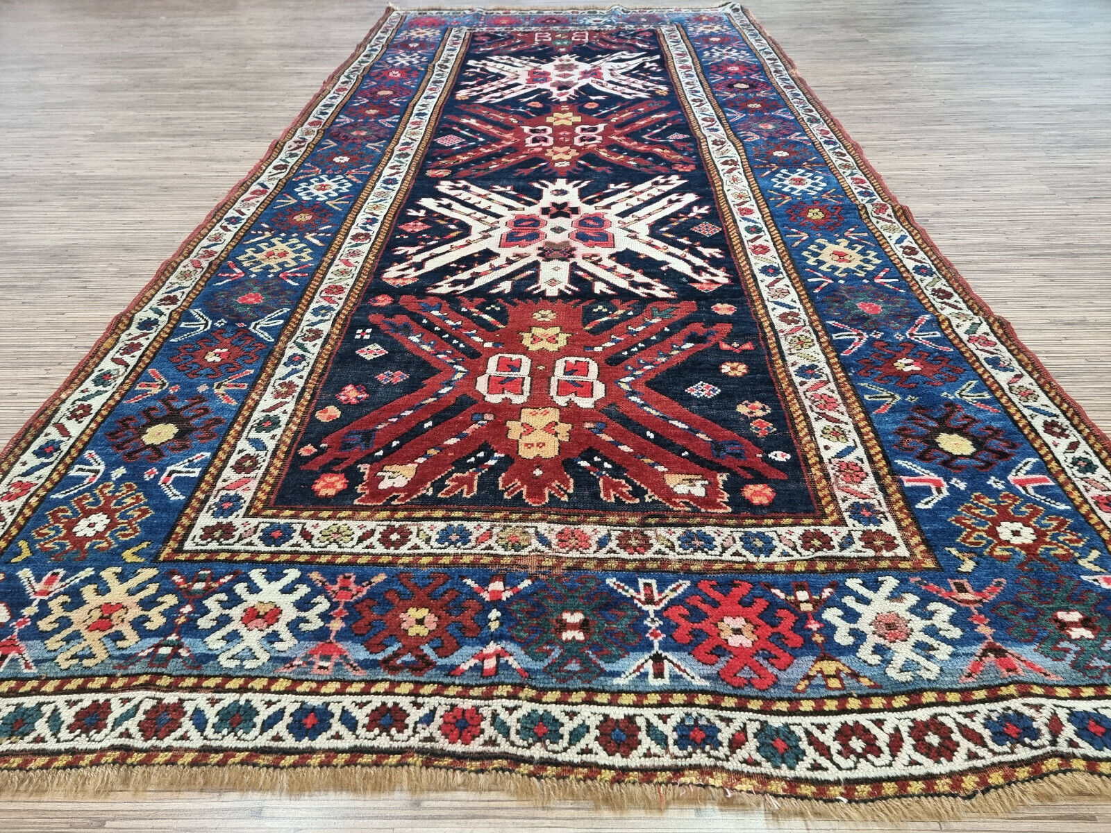 The rich wool texture of the 1900s Handmade Caucasian Kazak Rug
