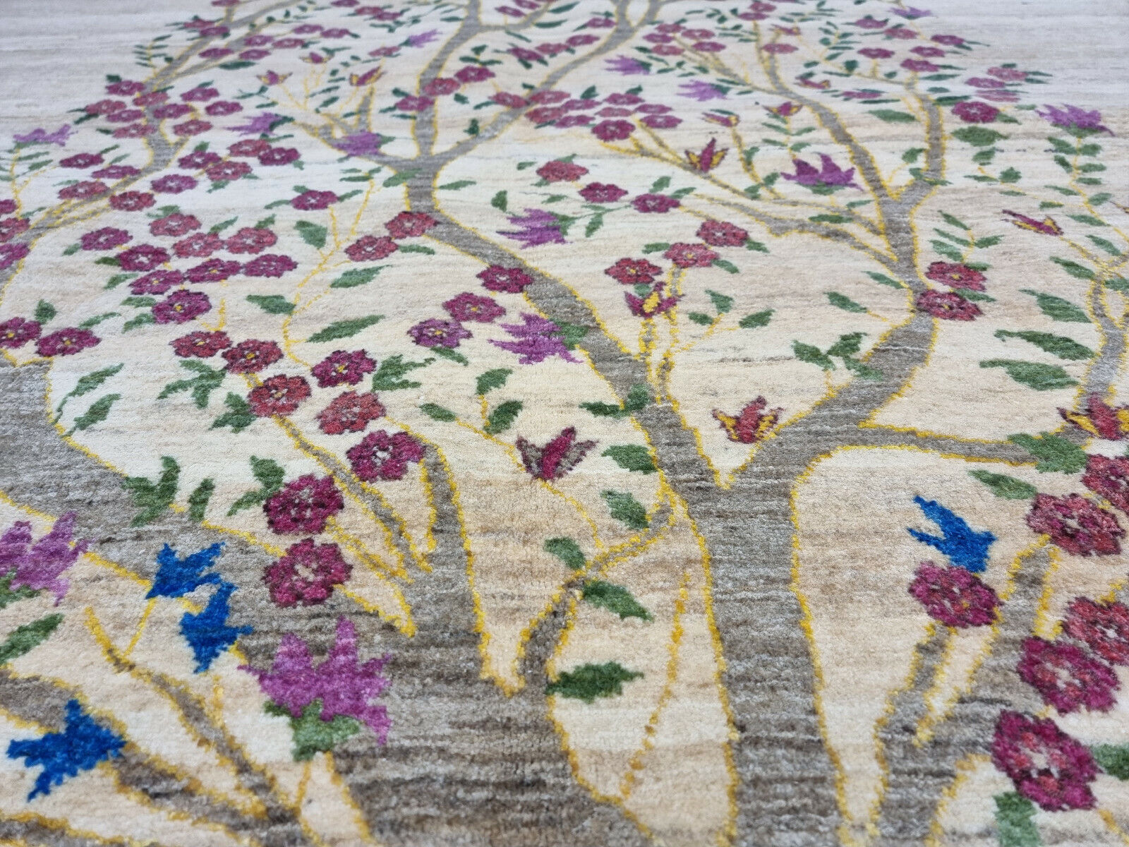 Artistic green and floral design elements on the Gabbeh rug

