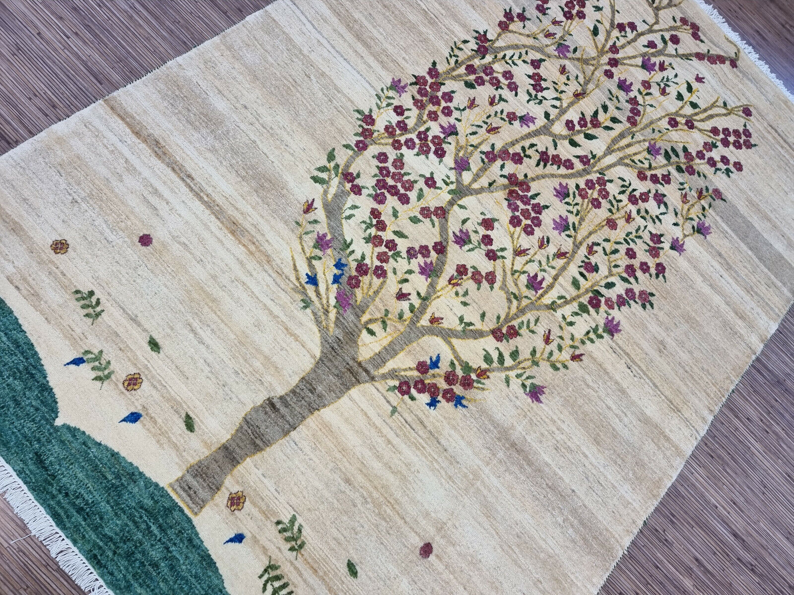 Close-up of the tree of life motif with multicolored flowers
