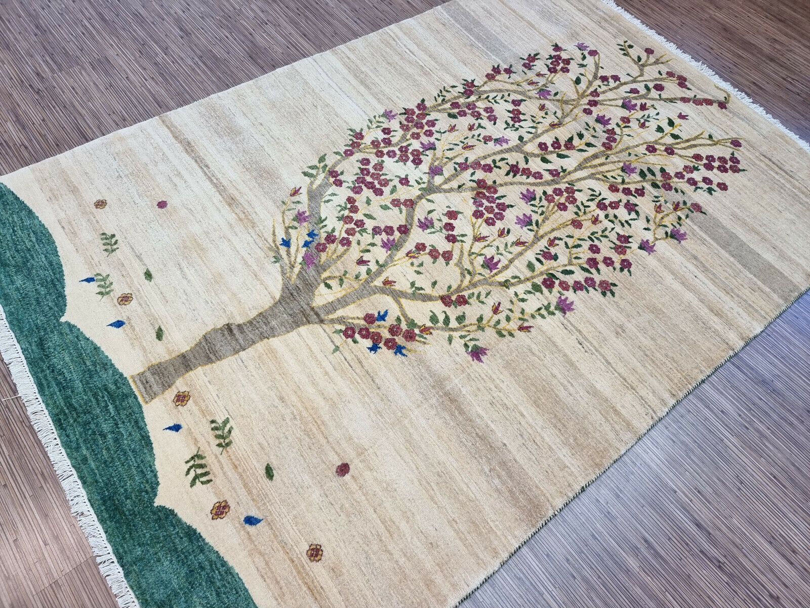Full spread of the vintage Gabbeh rug on hardwood flooring
