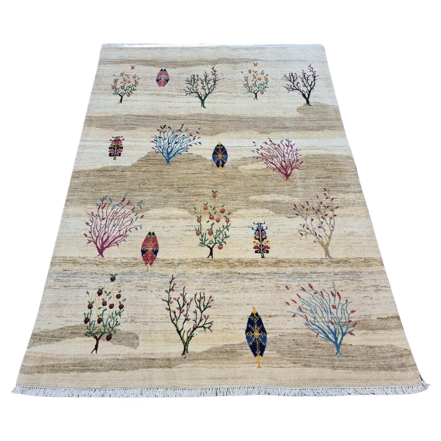 Full view of the Handmade Vintage Persian Gabbeh Rug with tree motifs
