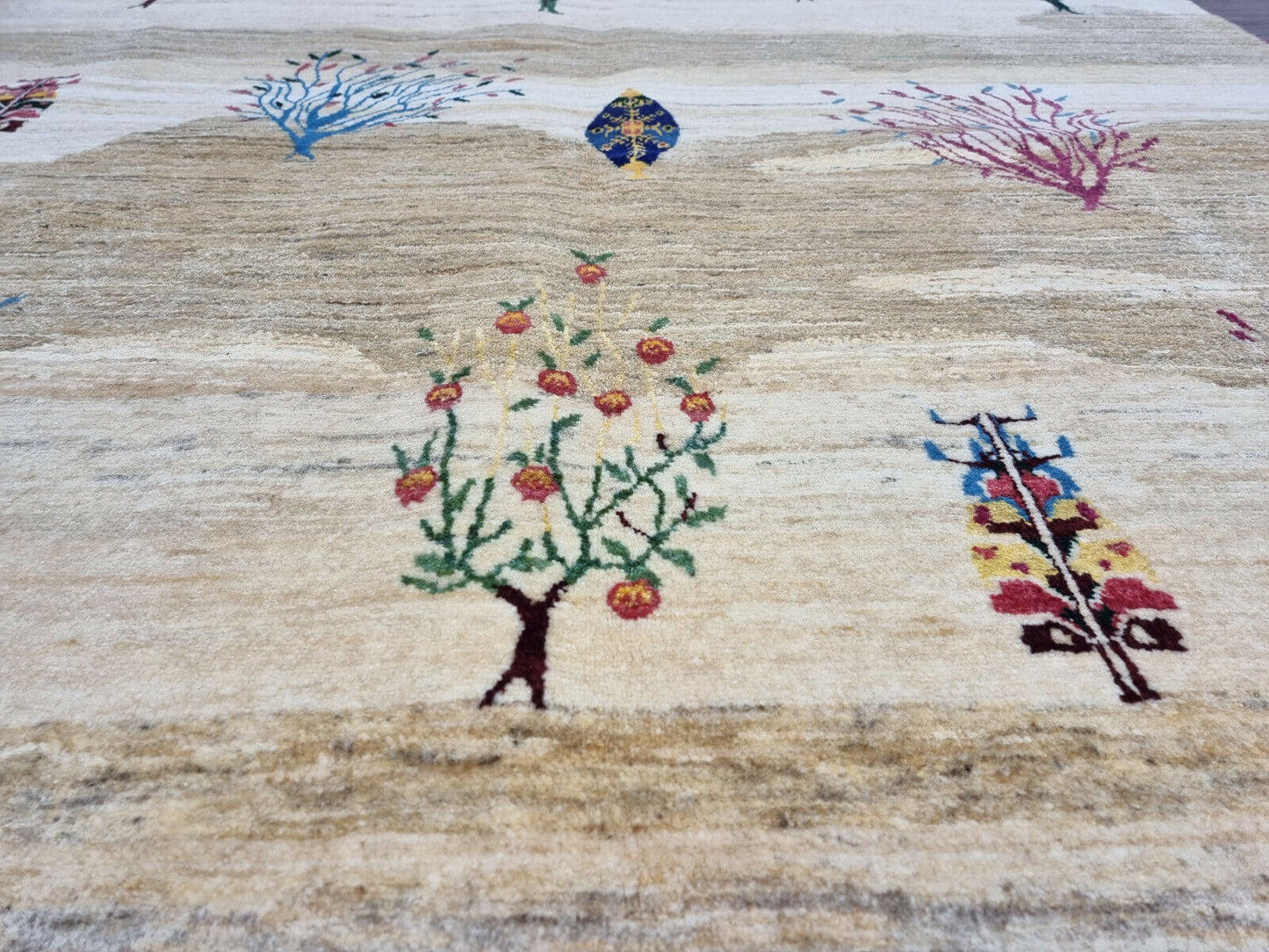 Close-up of a tree in vibrant colors on the Persian Gabbeh rug
