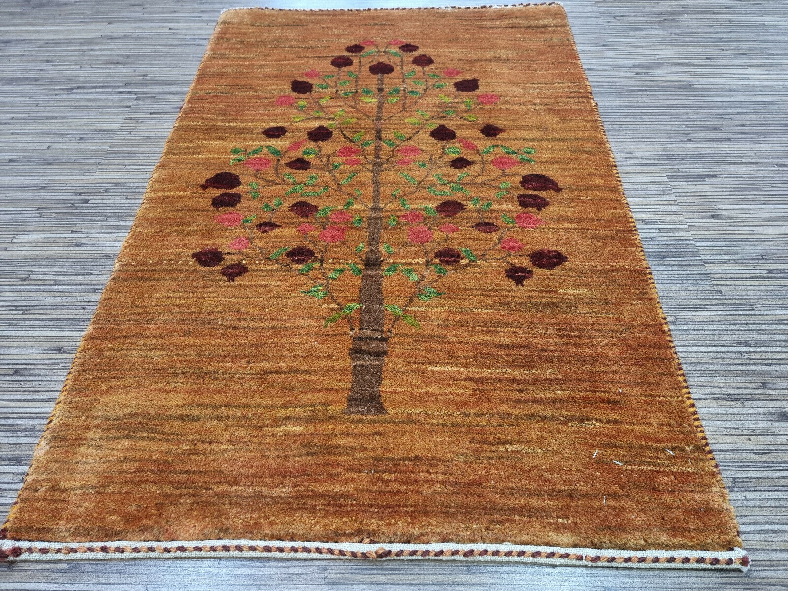 Close-up of Tree of Life pattern on Persian rug
