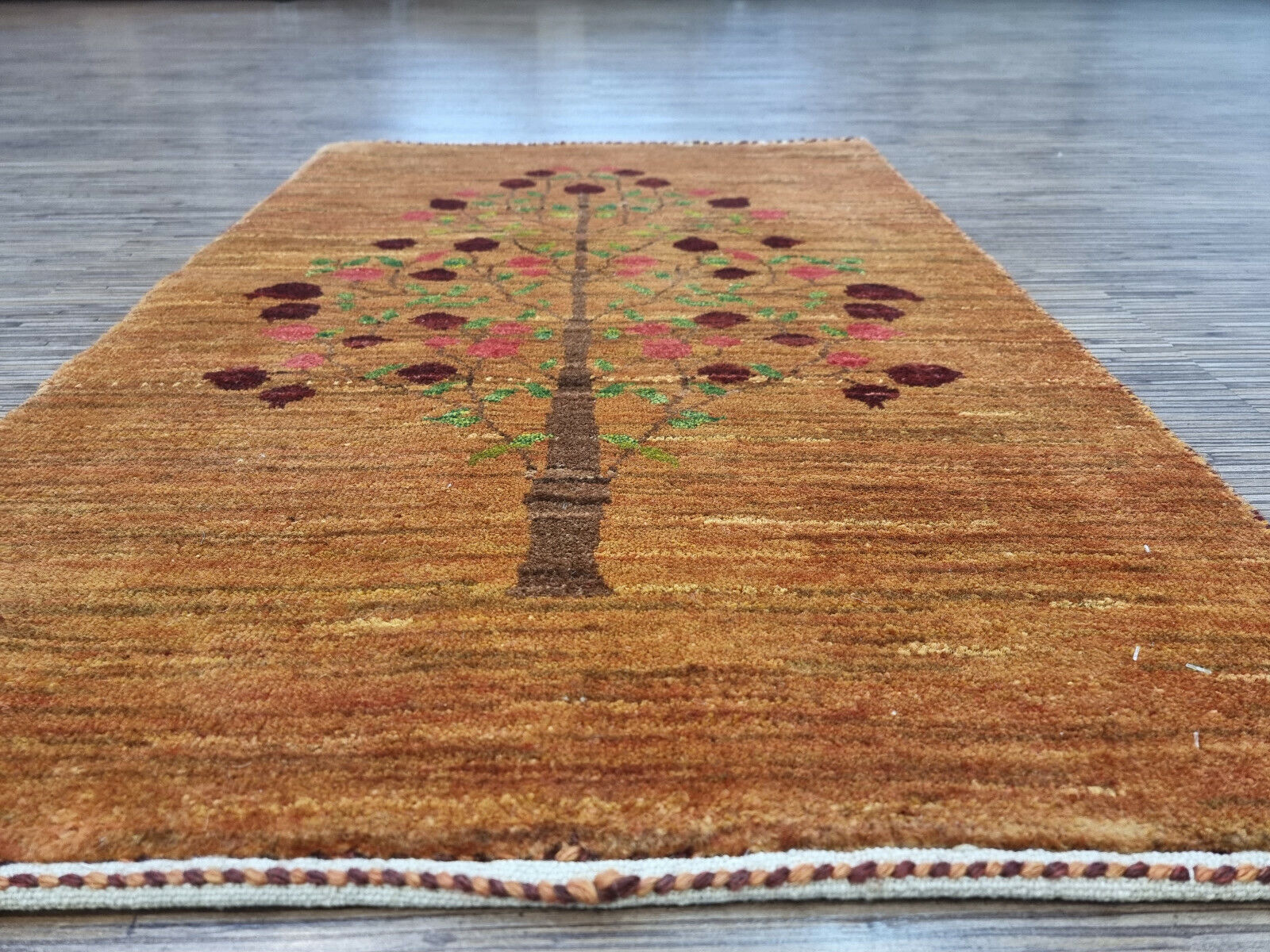 Tree of Life rug with vibrant pink and green accents
