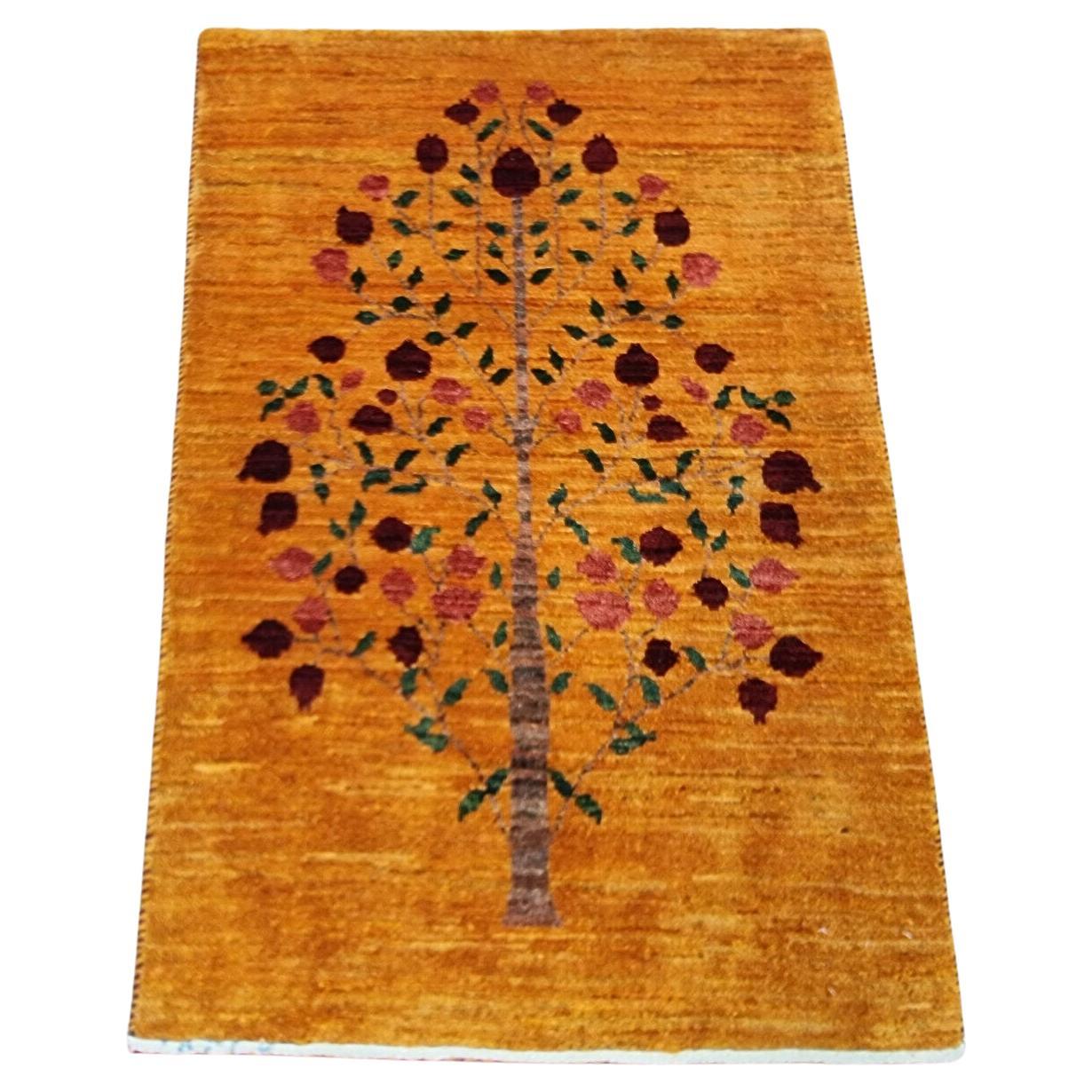Handmade Persian Gabbeh rug with tree motif, circa 1980s
