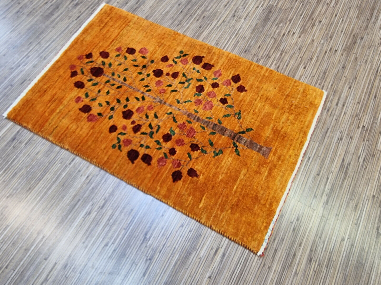 Rectangular handmade Persian rug in neutral tones
