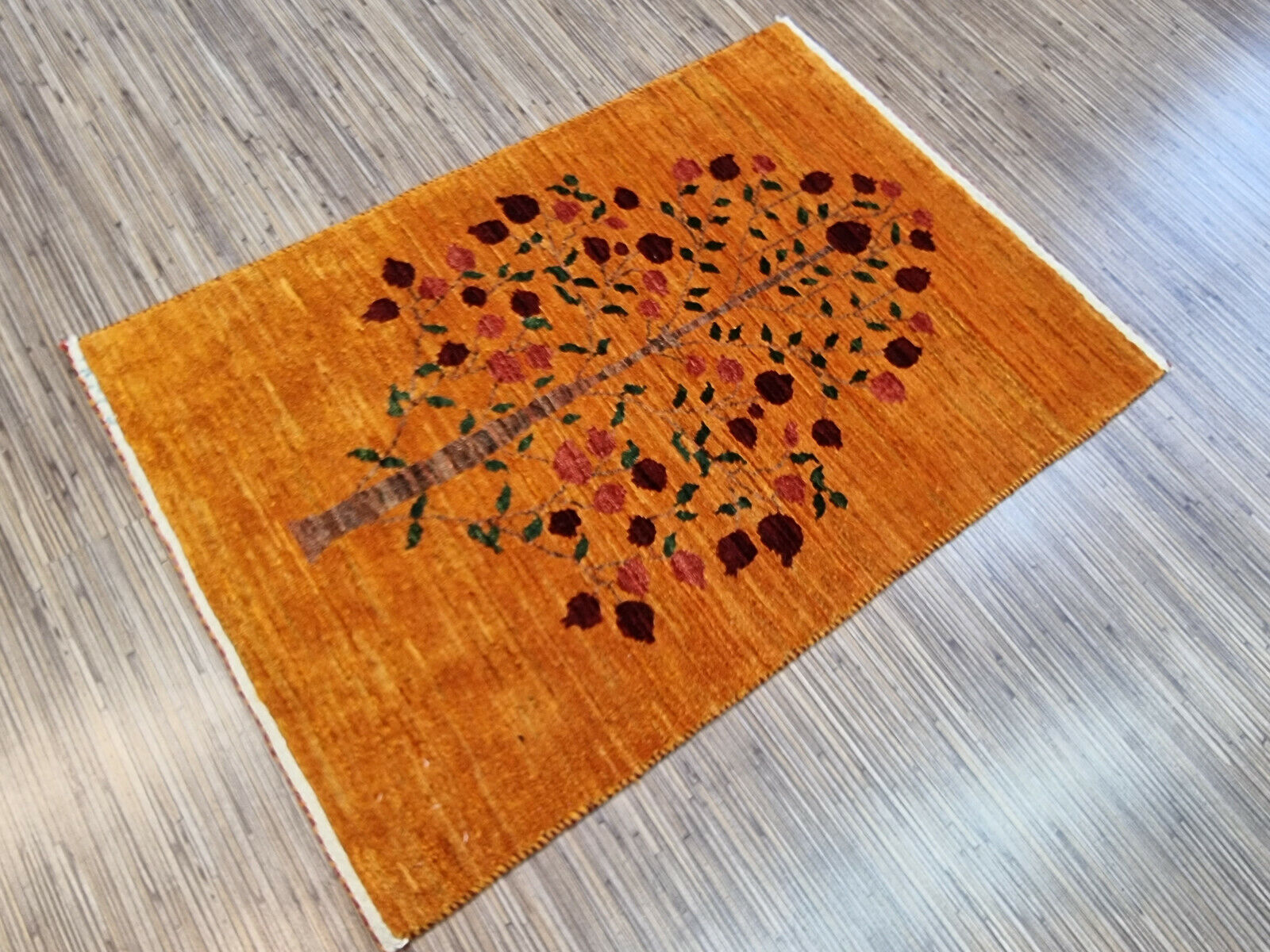 Vintage Persian Gabbeh rug rolled for storage
