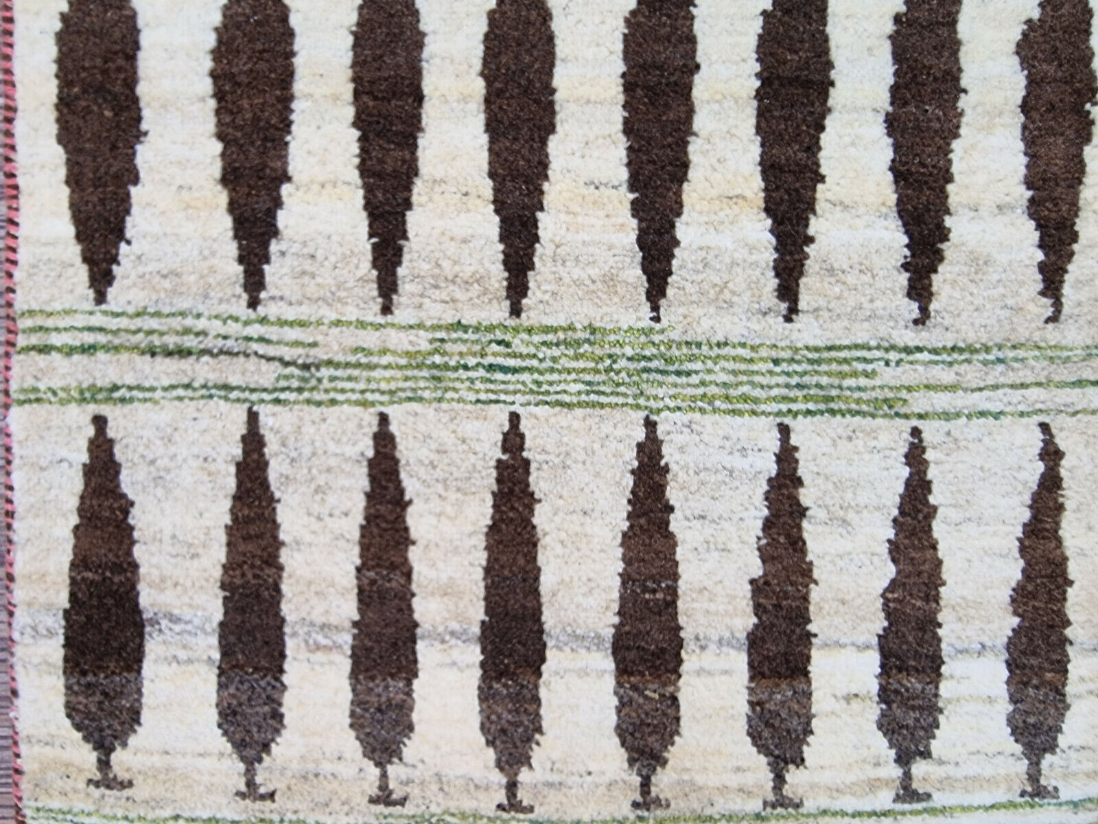 Hand-knotted tree motif on Persian Gabbeh rug (close-up view)
