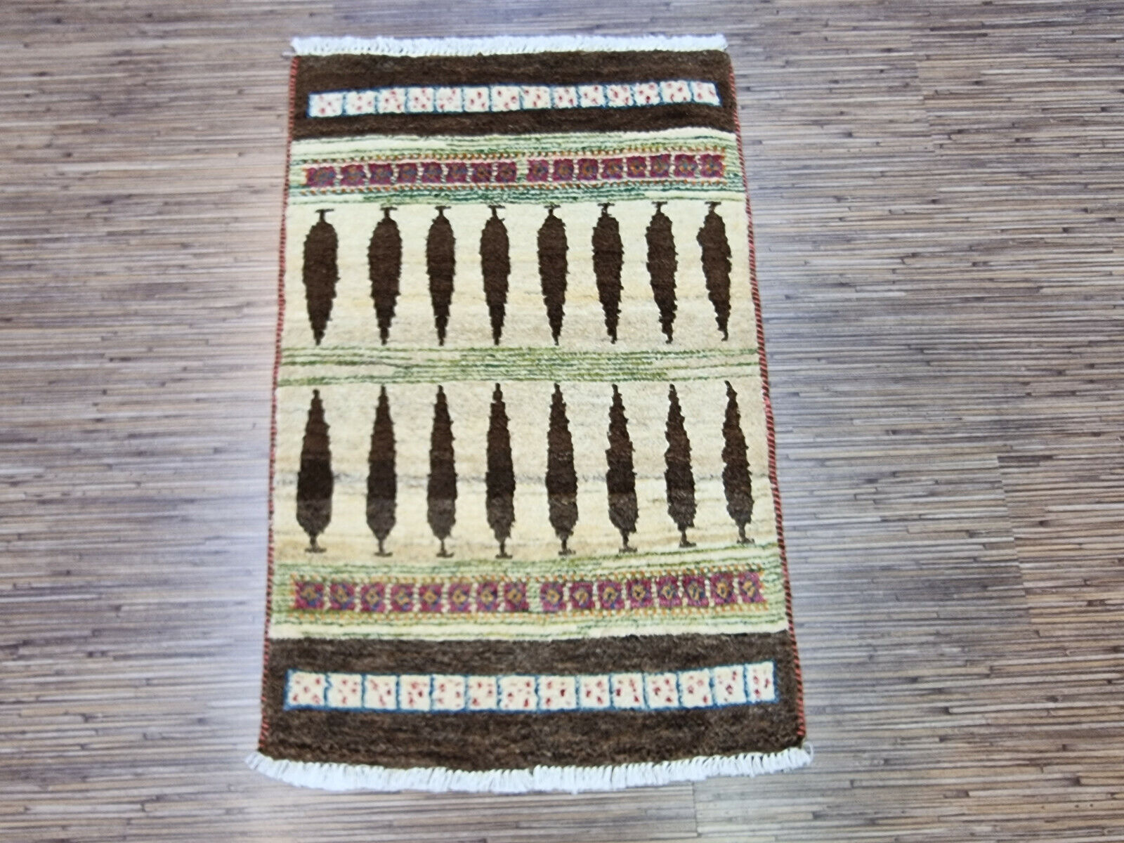 Close-up of tree motif design on Persian Gabbeh rug
