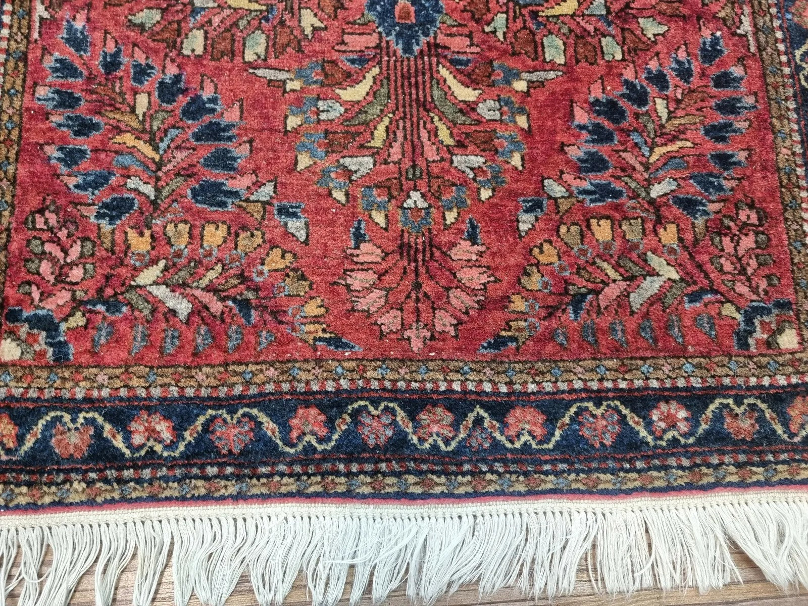 A detailed shot showcasing the rug’s intricate Persian Sarouk design

